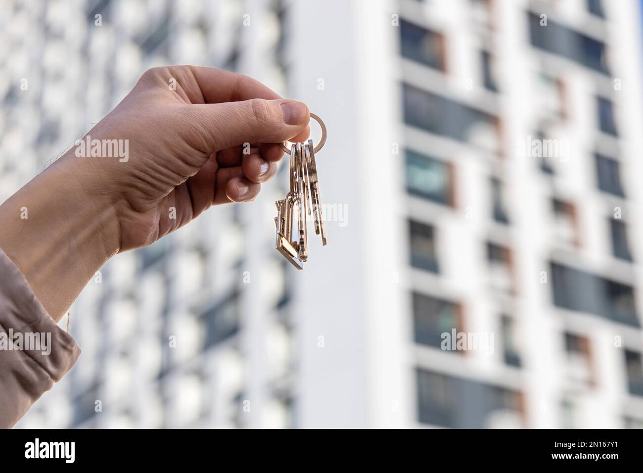 Key in house door hand hi-res stock photography and images - Alamy