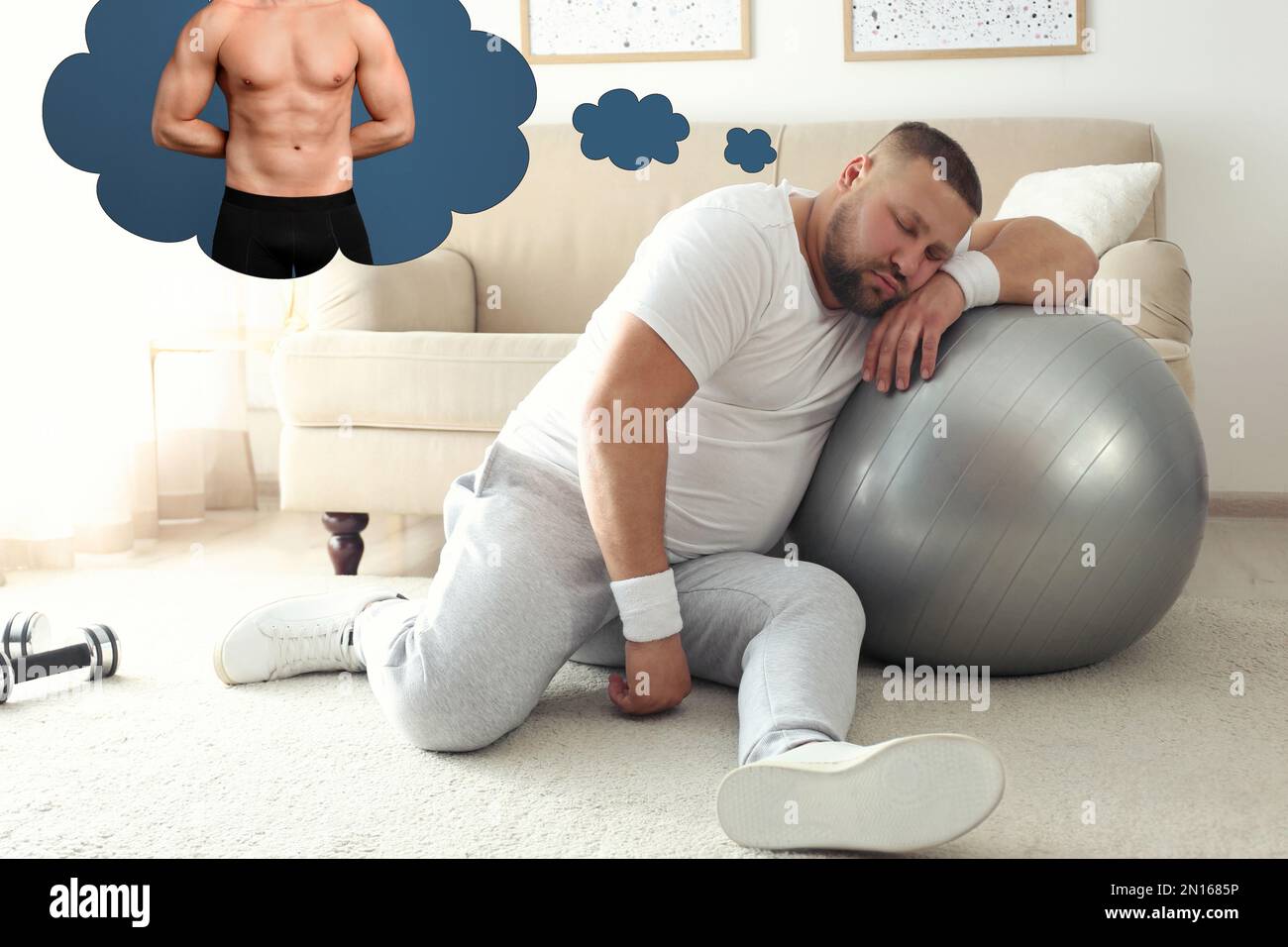 Overweight man dreaming about muscular body while having break in