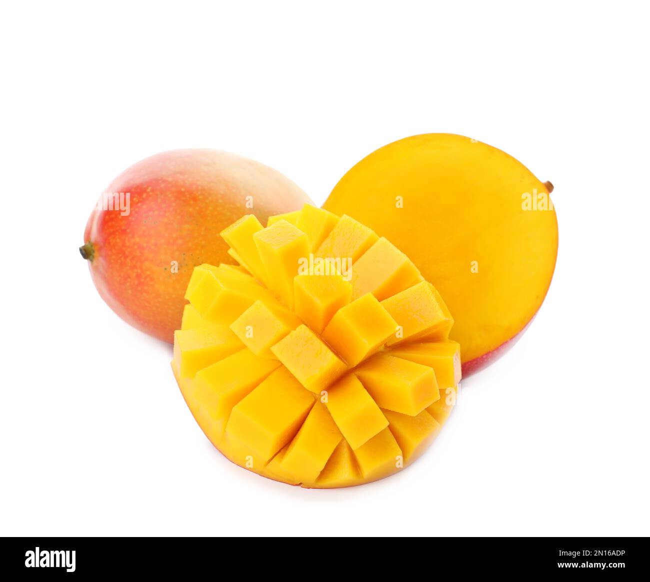 Whole and cut ripe mangoes isolated on white. Exotic fruit Stock Photo ...
