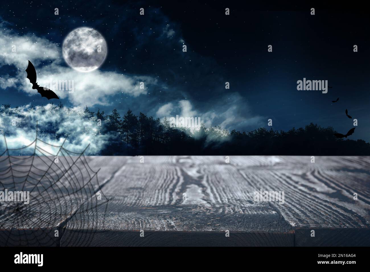 Wooden surface and bats flying in night sky with full moon. Halloween ...