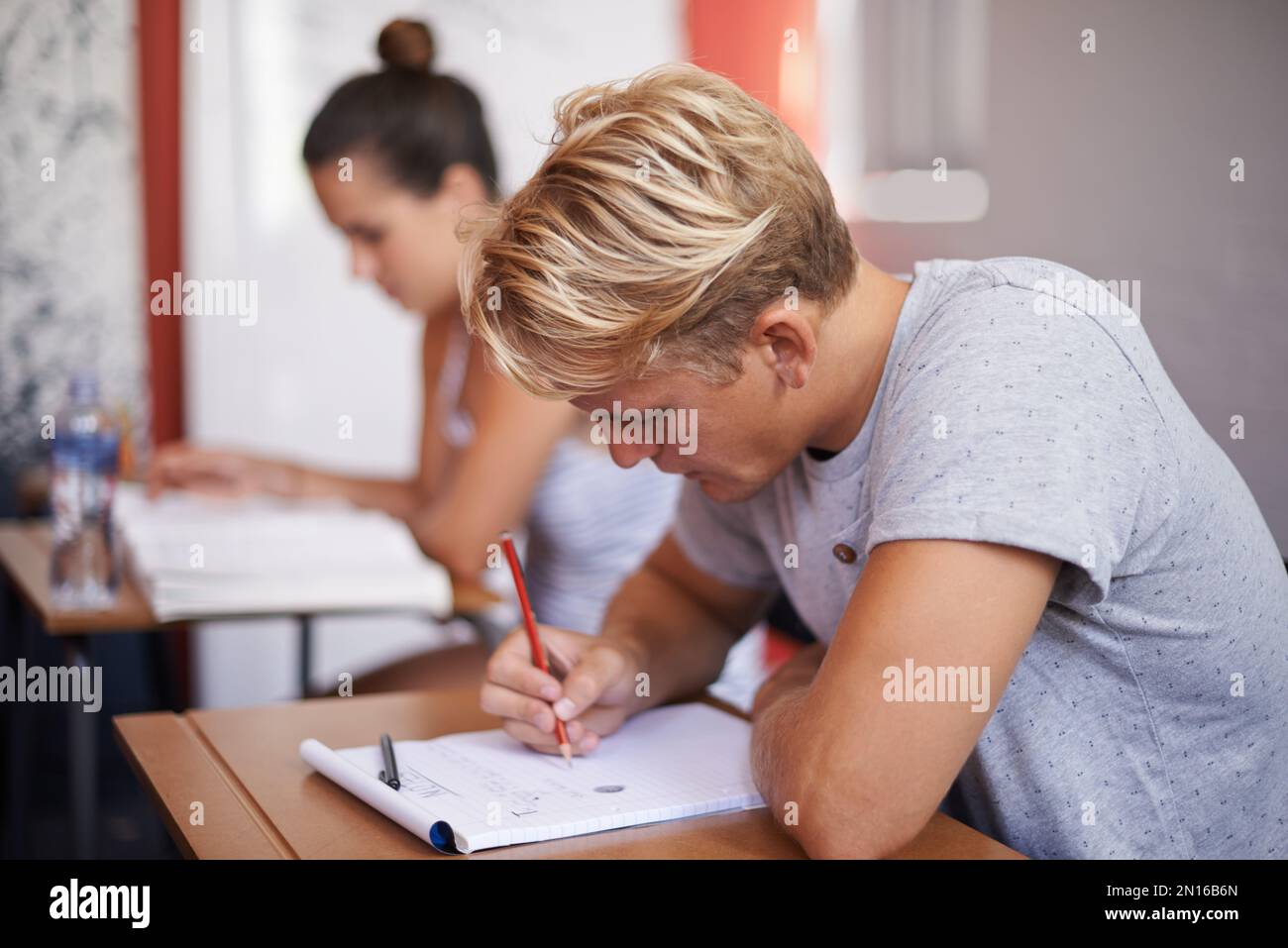 Hes totally focused. a group of university students studying together. Stock Photo