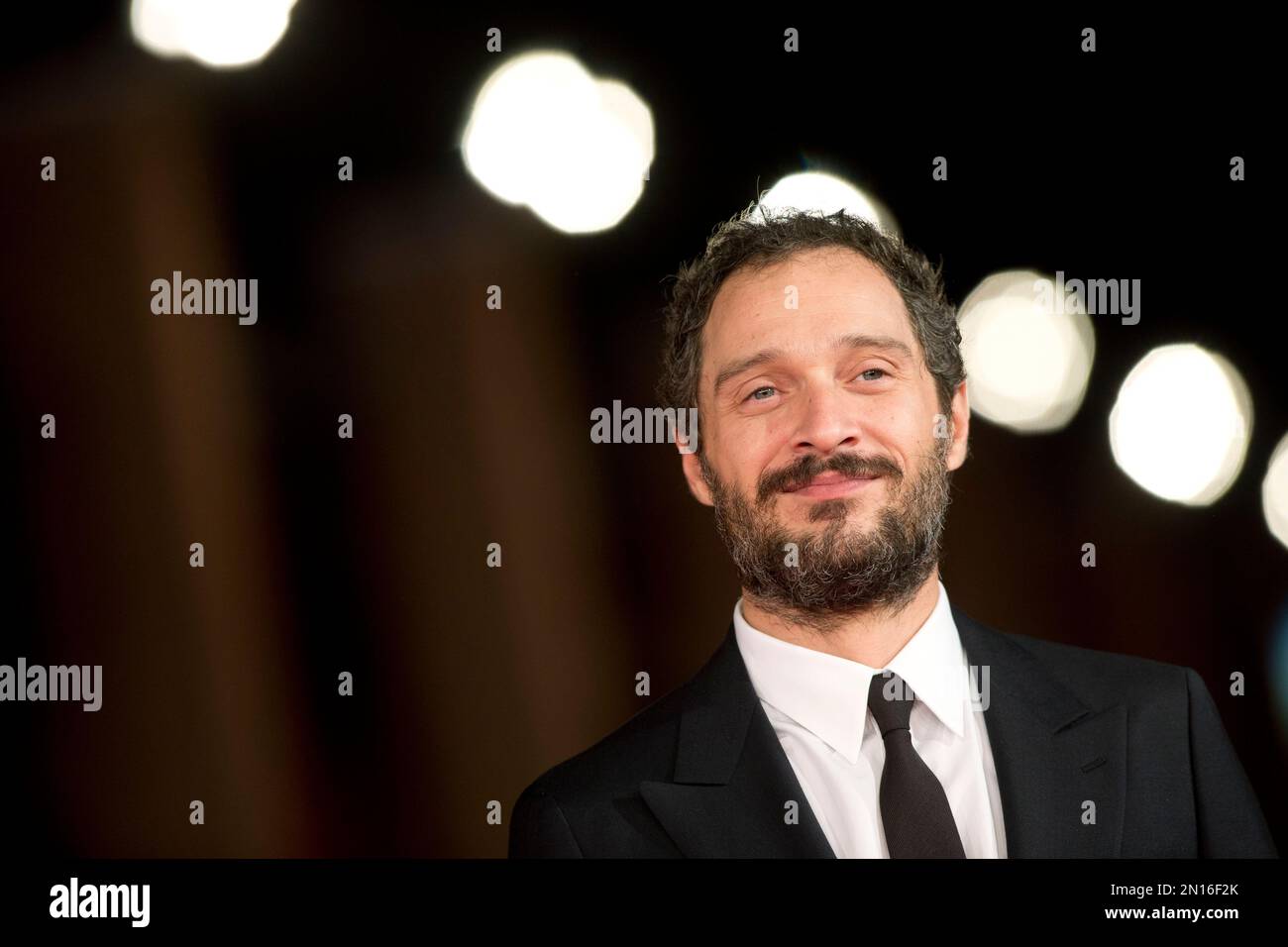 Actor Claudio Santamaria poses for photos as he arrives for the screening of the movie Lo Chiamavano Jeeg Robot (They Called Him Jeeg Robot), at Rome's Film Festival, in Rome, Saturday, Oct. 17, 2015. (AP Photo/Andrew Medichini) Stock Photo