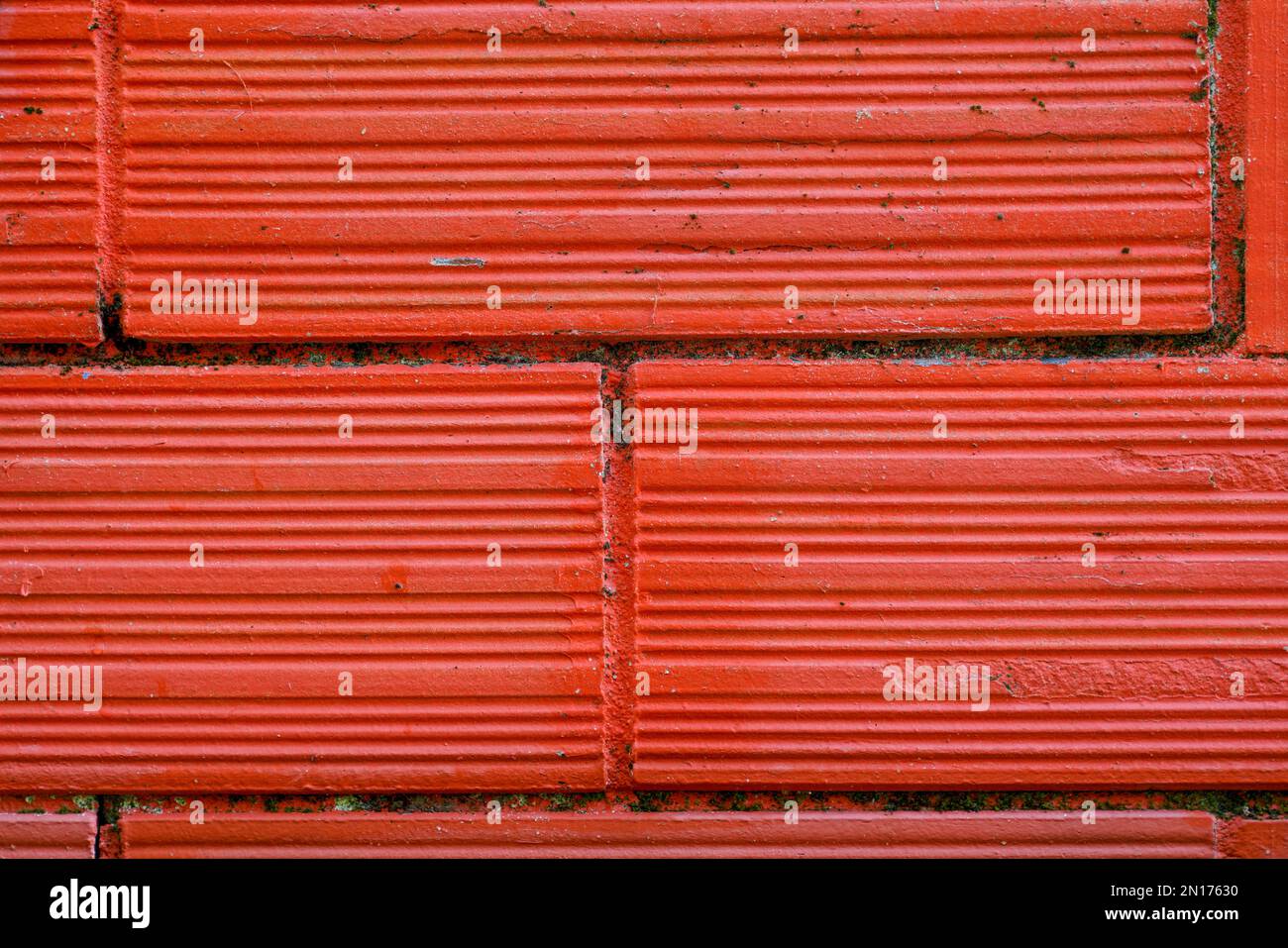 red brick cinder block and fence facade wall background Stock Photo Alamy