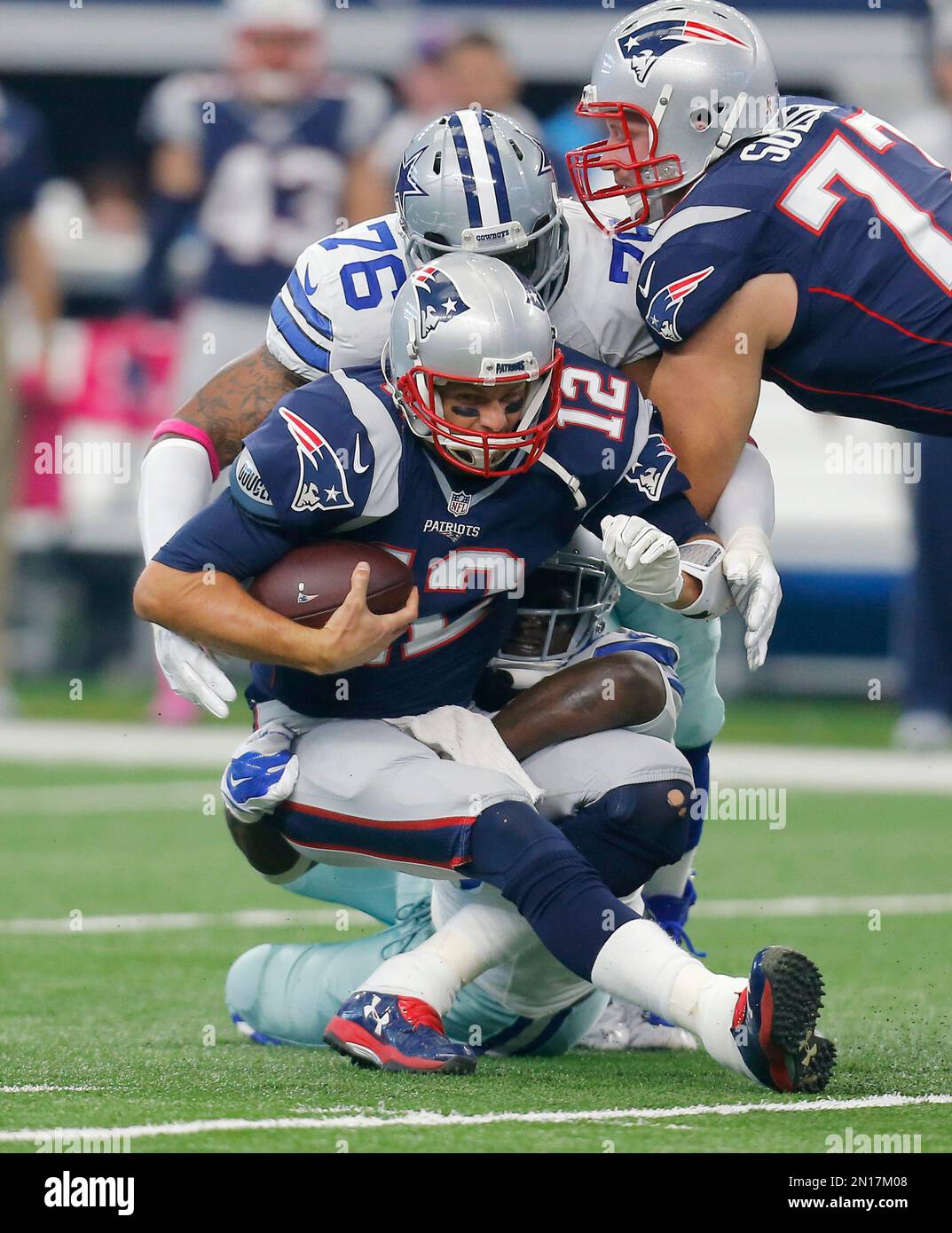 New England Patriots' Tom Brady (12) is sacked by Dallas Cowboys' Greg  Hardy (76) and Rolando McClain during the first quarter of an NFL football  game, Sunday, Oct. 11, 2015, in Arlington,