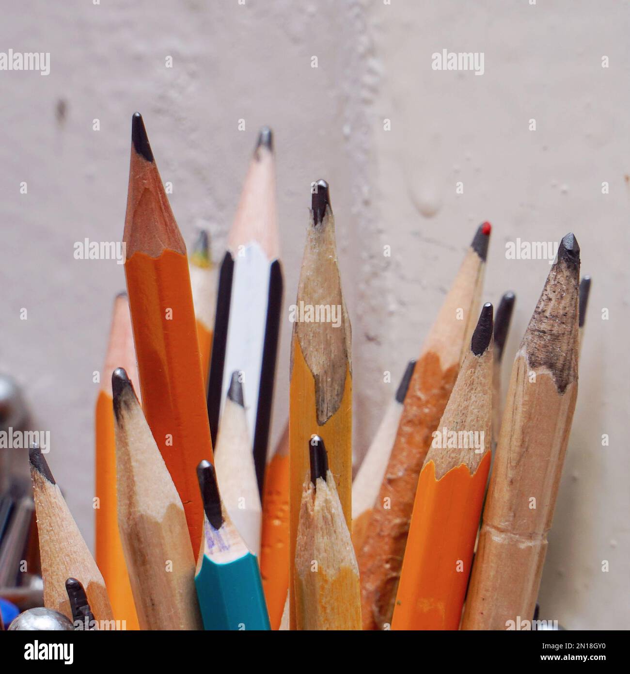 Different pencils in a jar on the table. Selective focus Stock Photo