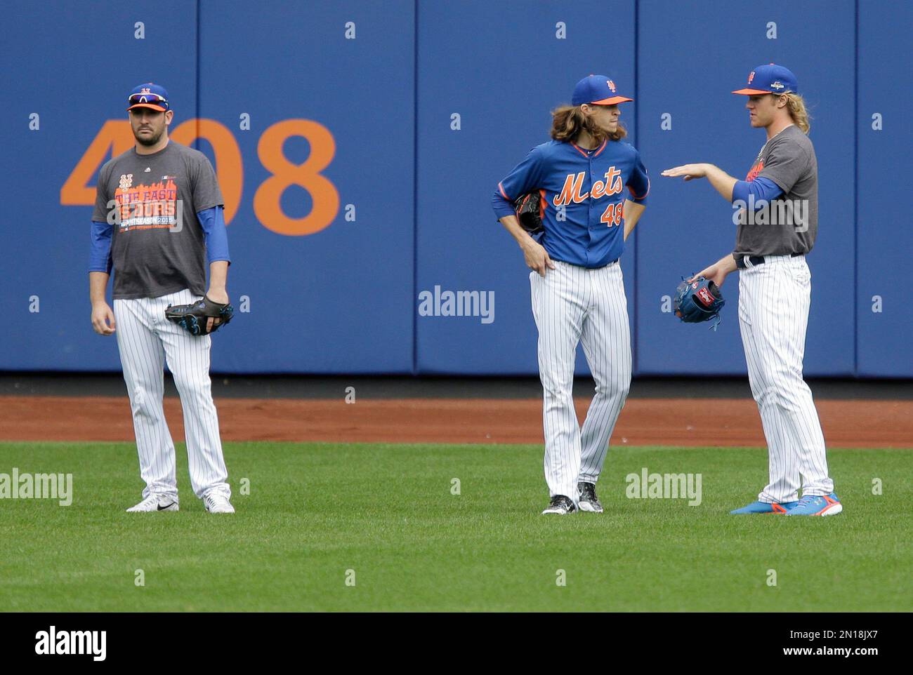 New York Mets pitchers Noah Syndergaard, Jacob deGrom and Matt Harvey (L to  R) walk in from the bullpen prior to playing the Los Angeles Dodgers in  game 4 of the NLDS