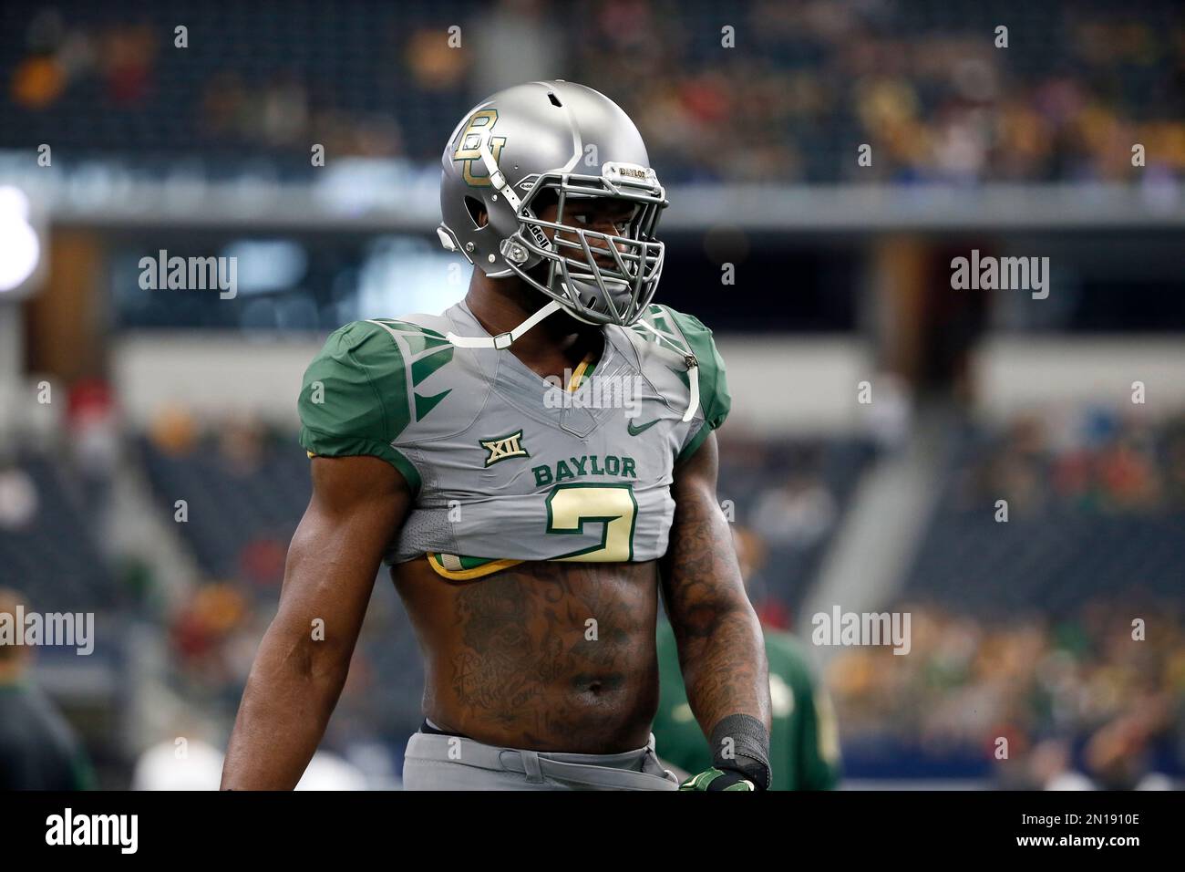 Baylor defensive end Shawn Oakman participates in warm up drills before