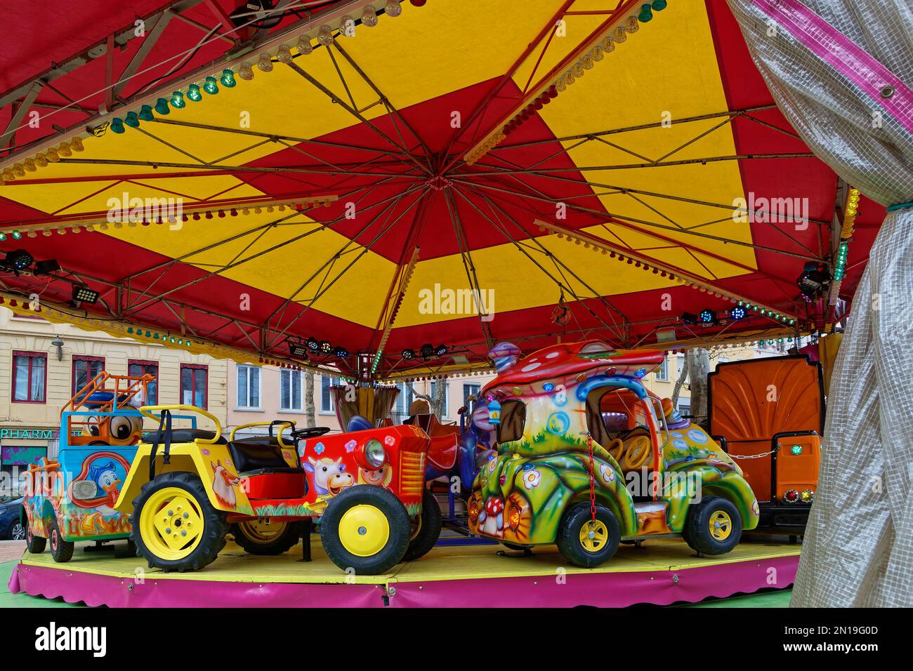 LYON, FRANCE, February 4, 2023 : Merry-go-round for children at the famous funfair of Croix-Rousse district. Stock Photo