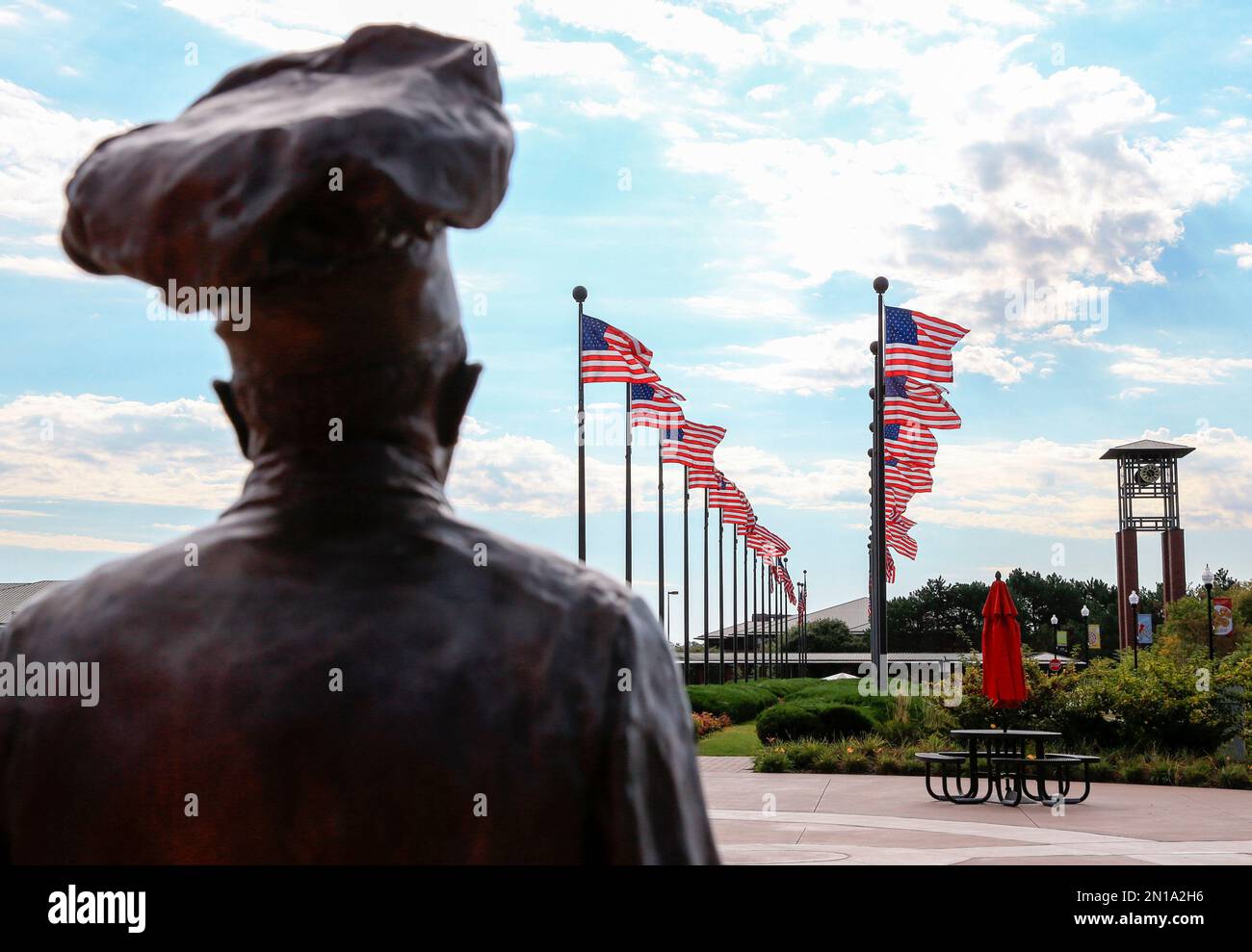 A statue of Chef Boyardee looks over flags at the world headquarters of