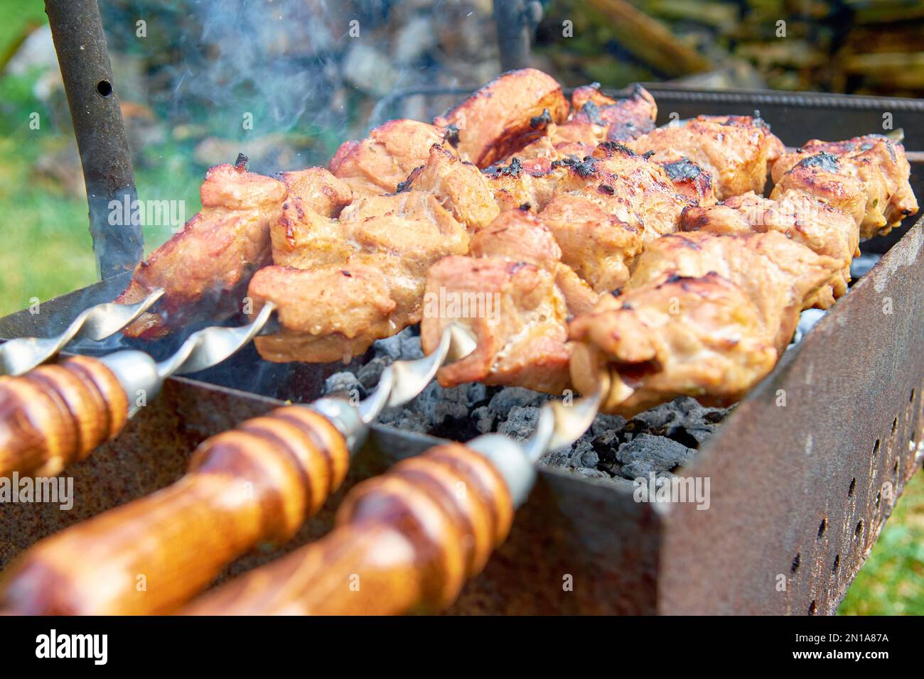Embers Cooking pork skewers brazier fire embers skewers food holiday food cooking ...
