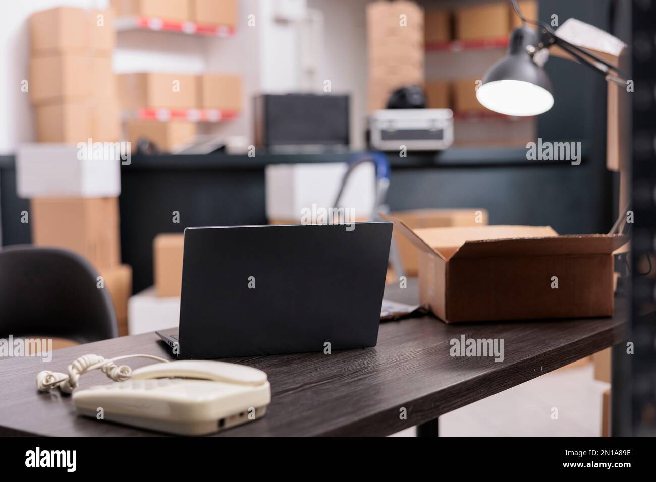 Empty large industrial storehouse equipped with tall metal shelves ...