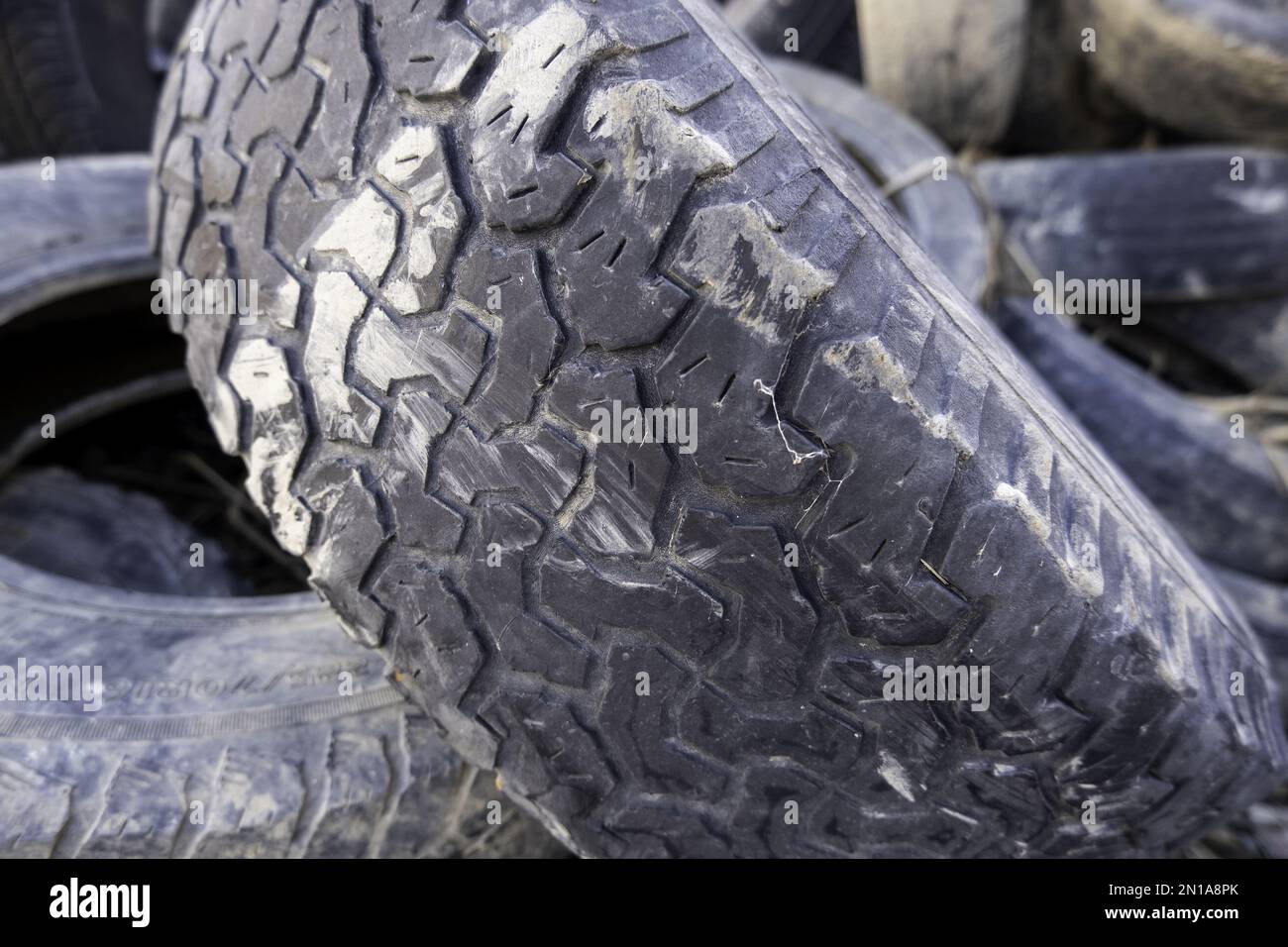 Detail of damaged and broken car tires, environmental pollution Stock Photo