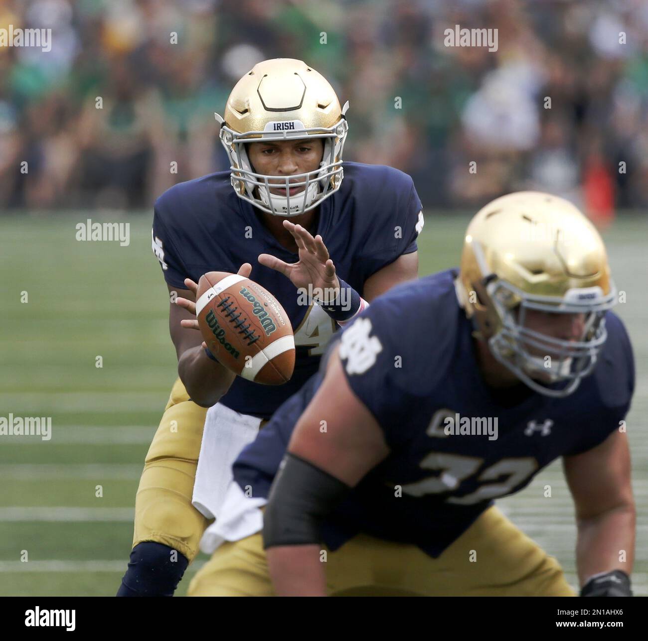 Notre Dame quarterback DeShone Kizer takes the snap in the shotgun