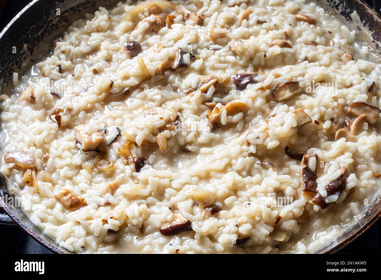 Wild mushroom risotto, an Italian dish made with Arborio rice Stock Photo Alamy