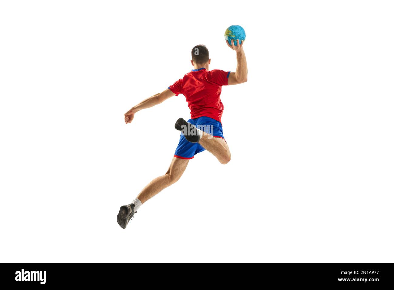 Back view studio shot of young man, professional handball player