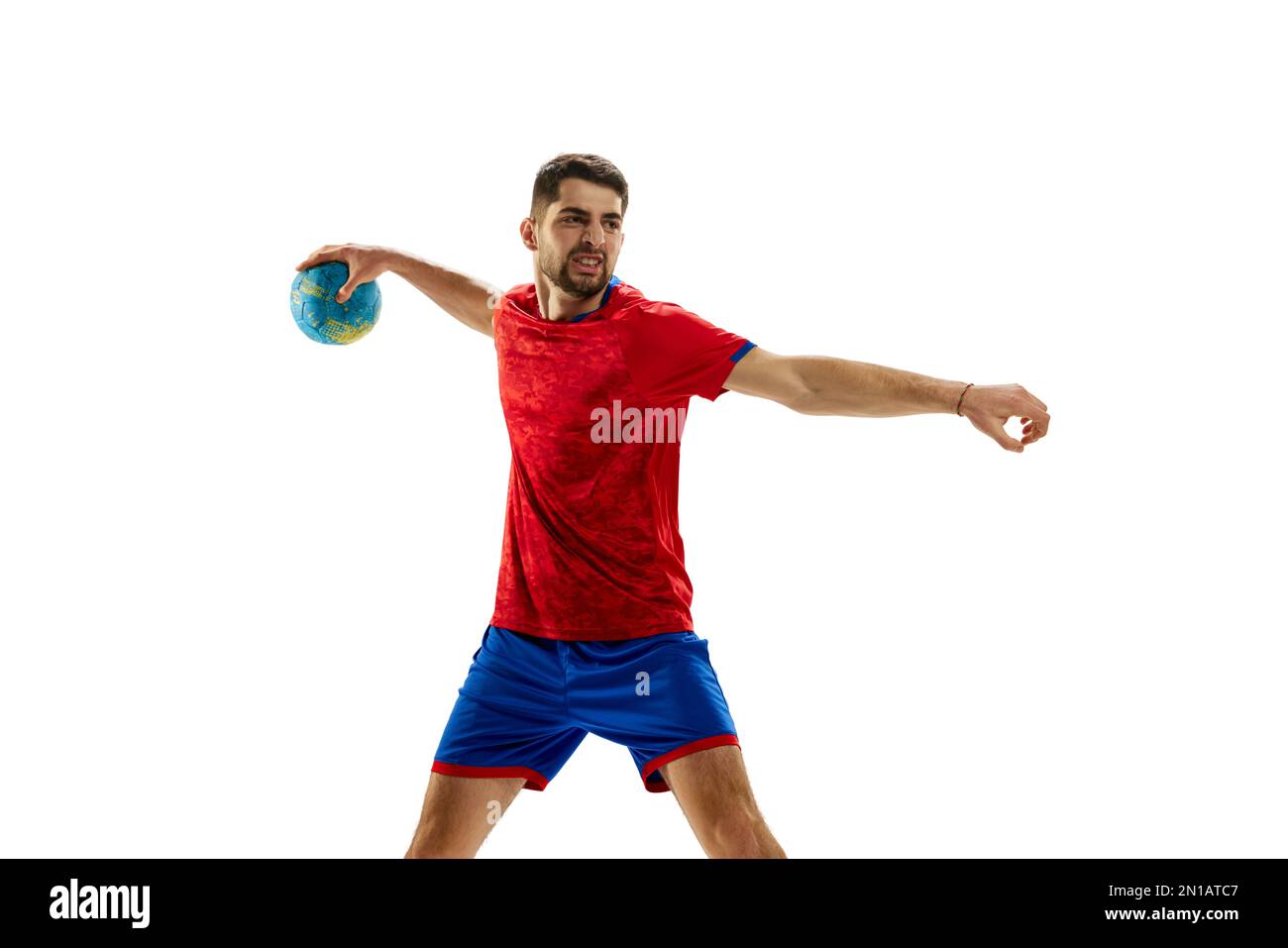 Motivation to win. Young man, professional handball player in red