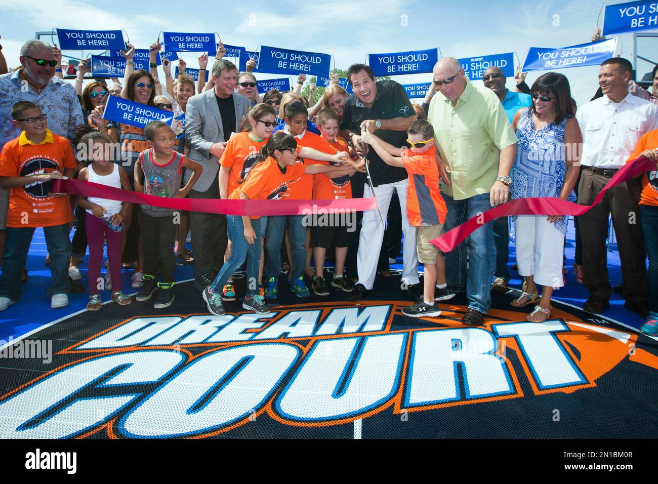 IMAGE DISTRIBUTED FOR DREAMCOURTS - Wayne Nugent, founder of WorldVentures,  cuts the ribbon on the first DreamCourt in Oklahoma City on Thursday, Sept.  24, 2014. The DreamCourt is located at the Boys