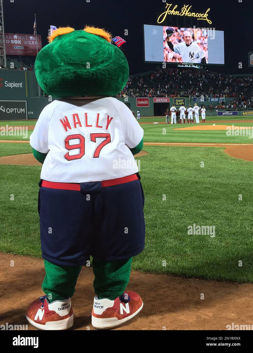 Boston Red Sox's mascot Wally the Green Monster and players