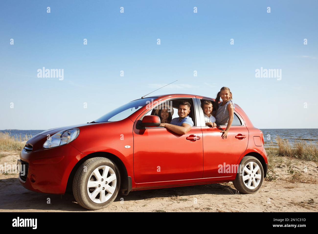 Family in car window man woman hi-res stock photography and images - Alamy