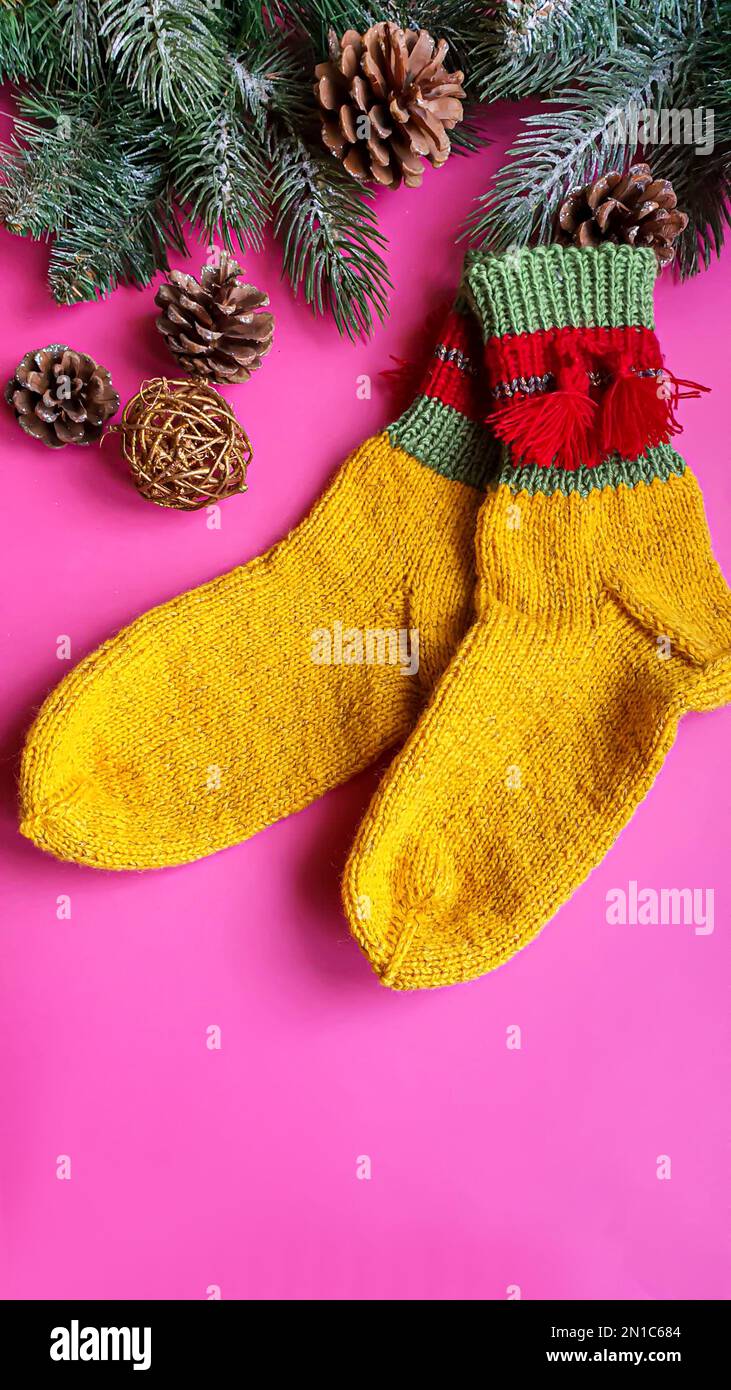 Knitted handmade items. Knitted fabric from colored thread. Bright background. copy space Stock Photo