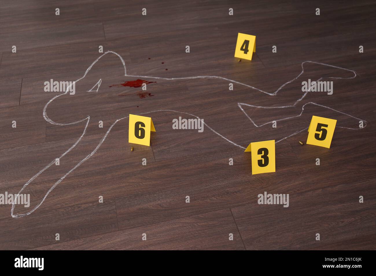Crime scene with chalk outline of human body, blood, bullet shells and
