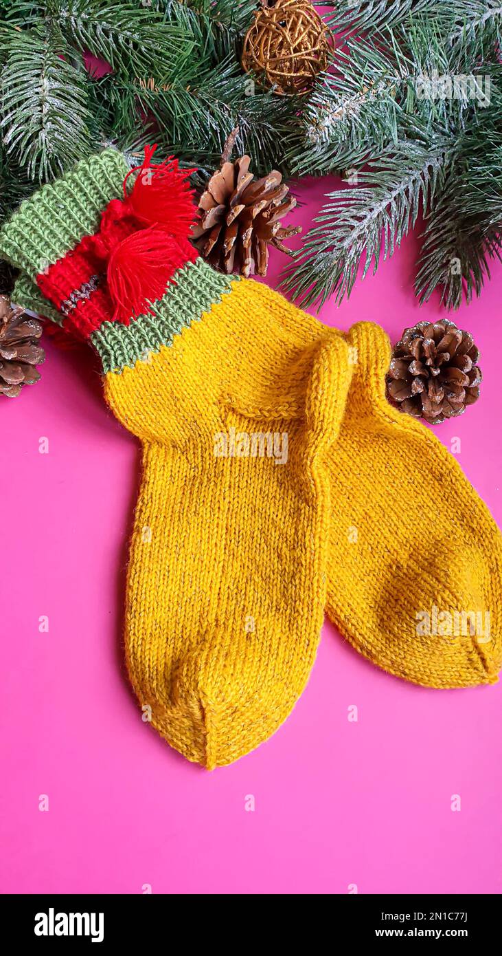 Knitted handmade items. Knitted fabric from colored thread. Bright background. copy space Stock Photo