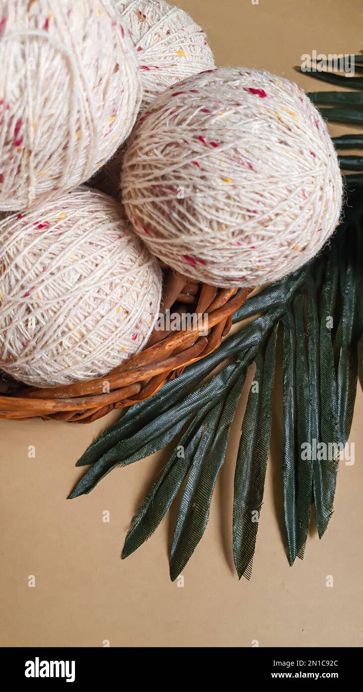 Knitted handmade items. Knitted fabric from colored thread. Bright background. copy space Stock Photo