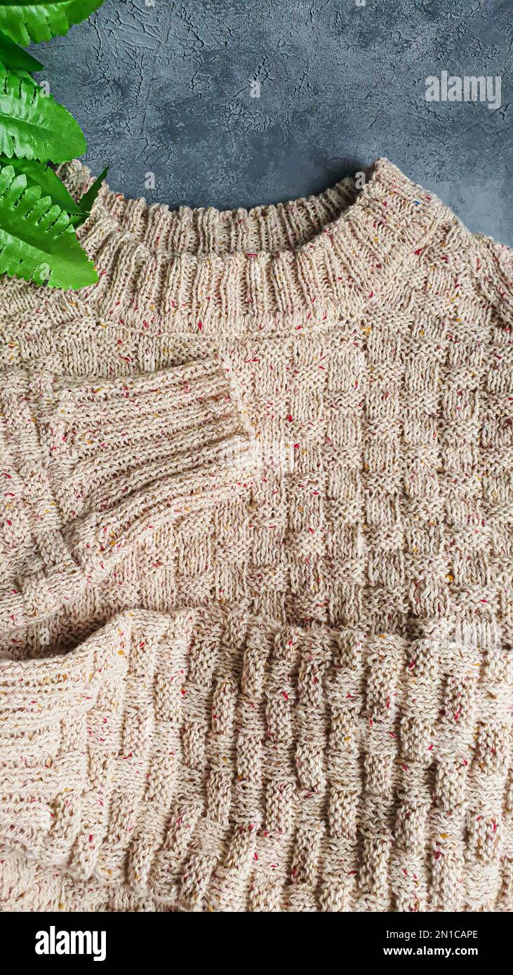 Knitted handmade items. Knitted fabric from colored thread. Bright background. copy space Stock Photo
