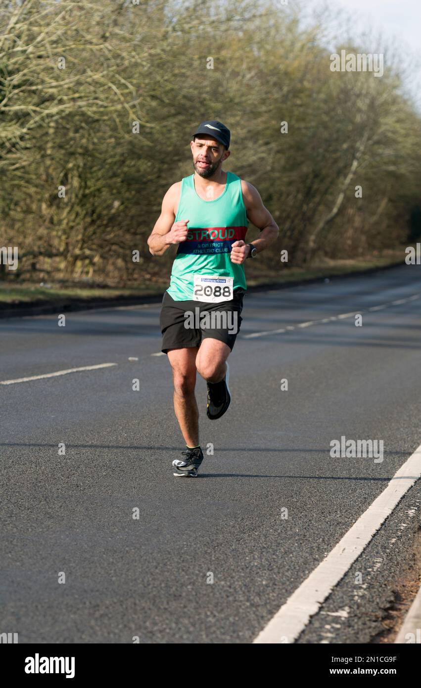 A runner in the Warwick Half Marathon, Warwick, Warwickshire, UK Stock Photo