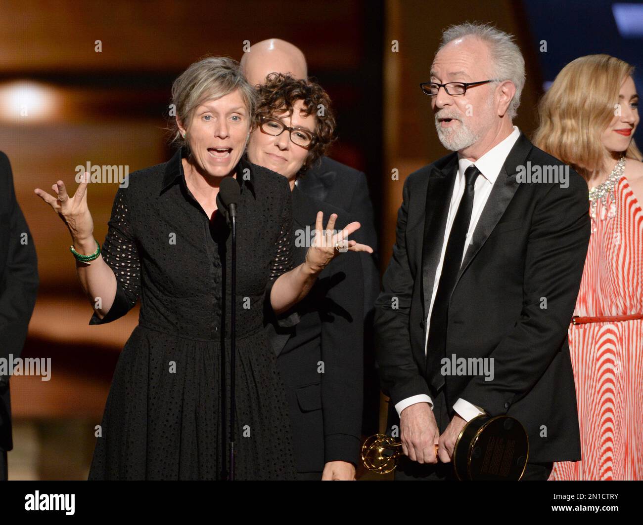 Francis McDormand, left, and the cast of "Olive Kitteridge" accepts the ...