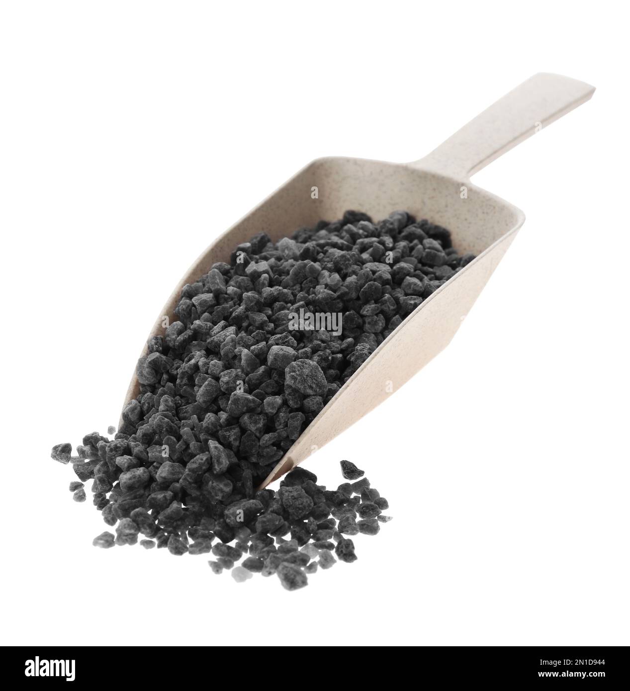 Black salt in plastic scoop on white background Stock Photo