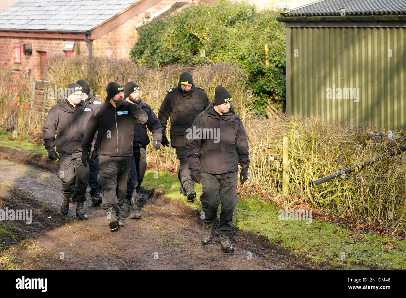 Police officers in St Michael's on Wyre, Lancashire, as the search for missing woman Nicola Bulley, 45, who was last seen on the morning of Friday January 27, when she was spotted walking her dog on a footpath by the nearby River Wyre. Picture date: Monday February 6, 2023. Stock Photo