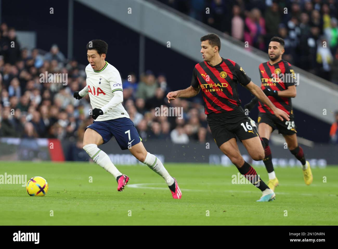 Tottenham Hotspur's Heung-Min Son beats Manchester City's Rodrigo during the English Premier League soccer match between Tottenham Hotspur and Manches Stock Photo