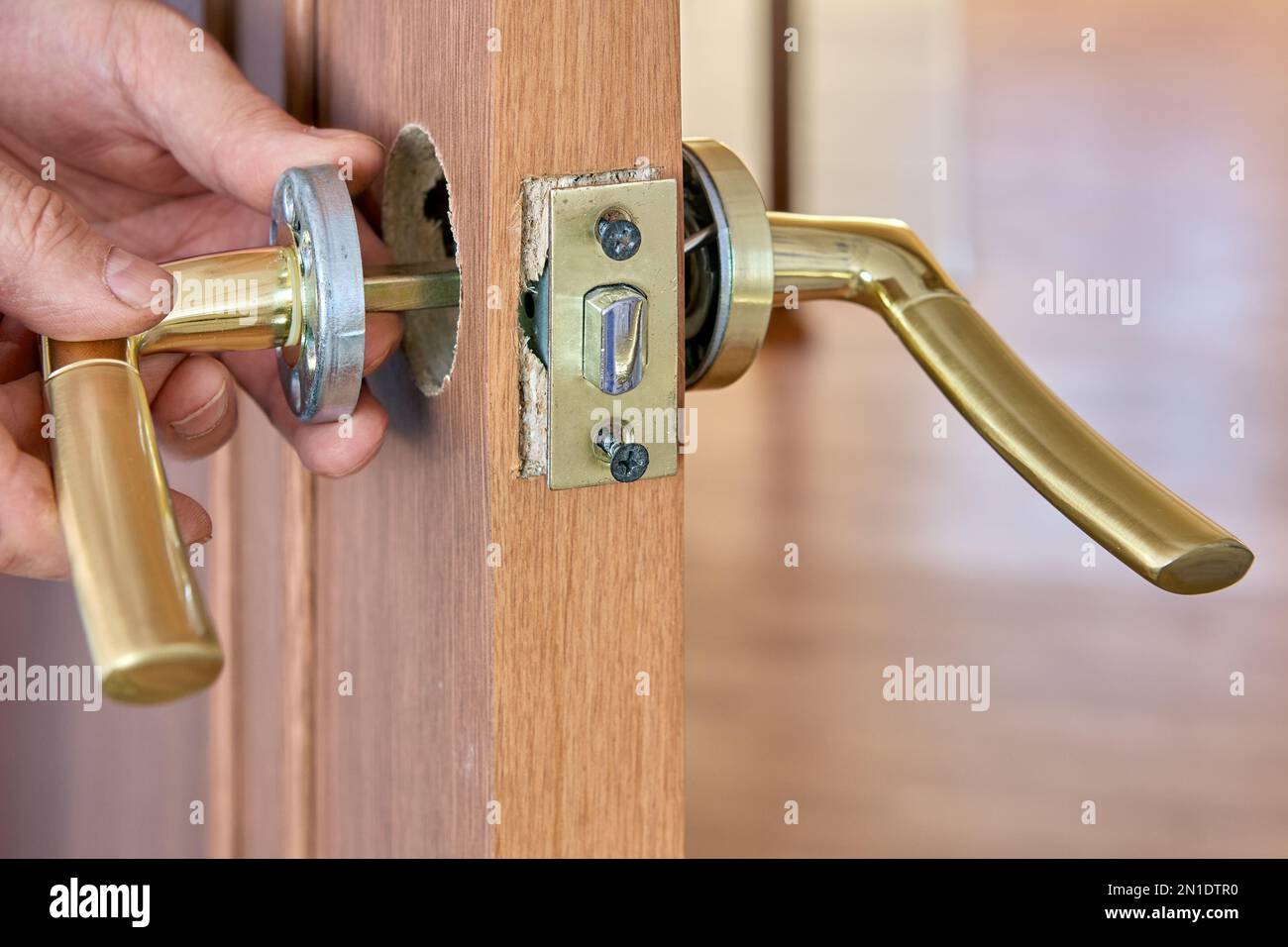 Repair of lever door handle with latch, dismantling of mechanism to