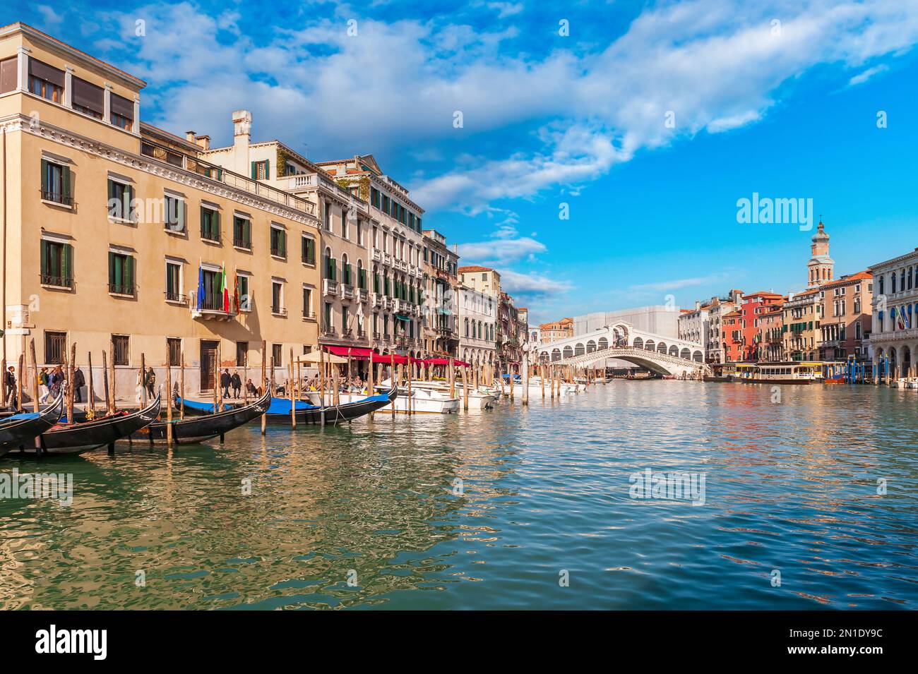 traffic on the Grand Canal near the Rialto Bridge in the background, in Venice, Veneto, Italy Stock Photo