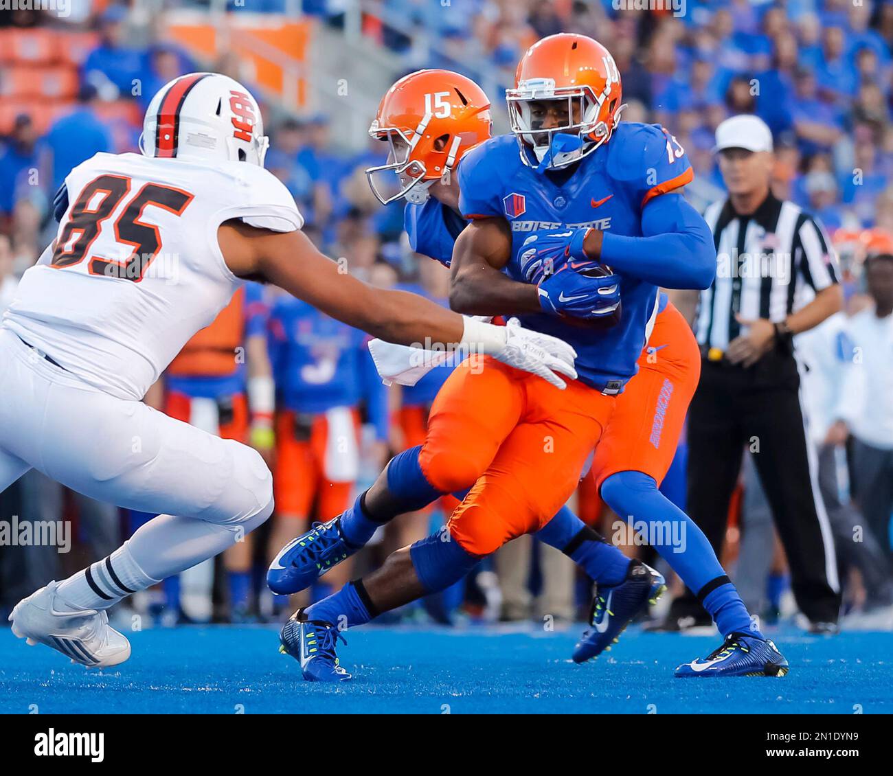 Boise State running back Jeremy McNichols (13) runs the ball against Idaho State defensive linesman Rasheed Williams (85) during the first half of an NCAA college football game in Boise, Idaho, on Friday, Sept. 18, 2015. (AP Photo/Otto Kitsinger) Stock Photo