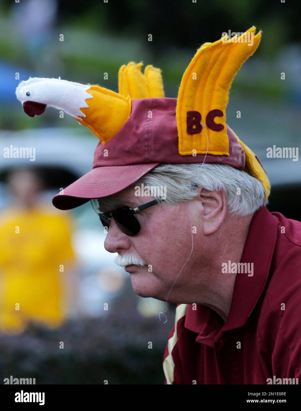 Boston College fan wears a BC Eagles hat prior to an NCAA college
