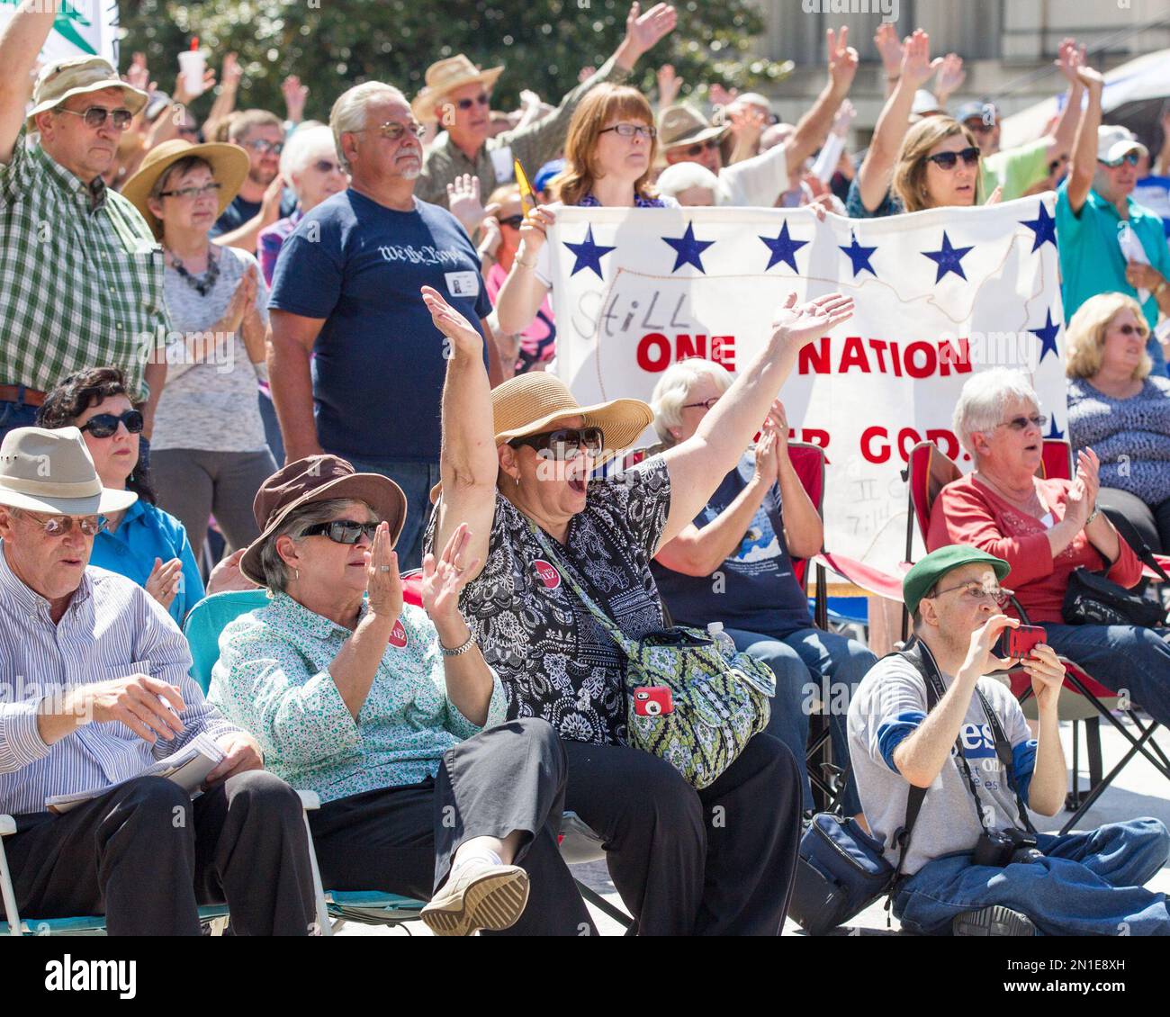 Members of the crowd cheer during a Christian conservatives rally ...