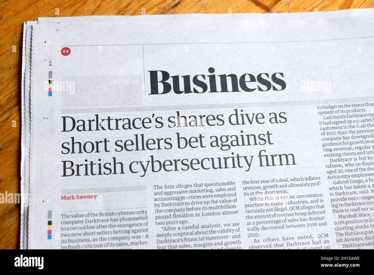 'Darktrace's shares dive as short sellers bet against cybersecurity firm' Guardian newspaper headline Business section article February 2023 London UK Stock Photo