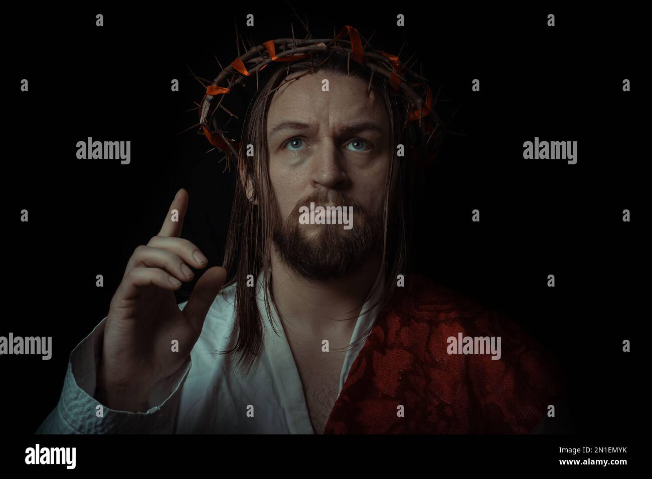 Jesus Christ wearing a crown of thorns and white chiton toga mantle