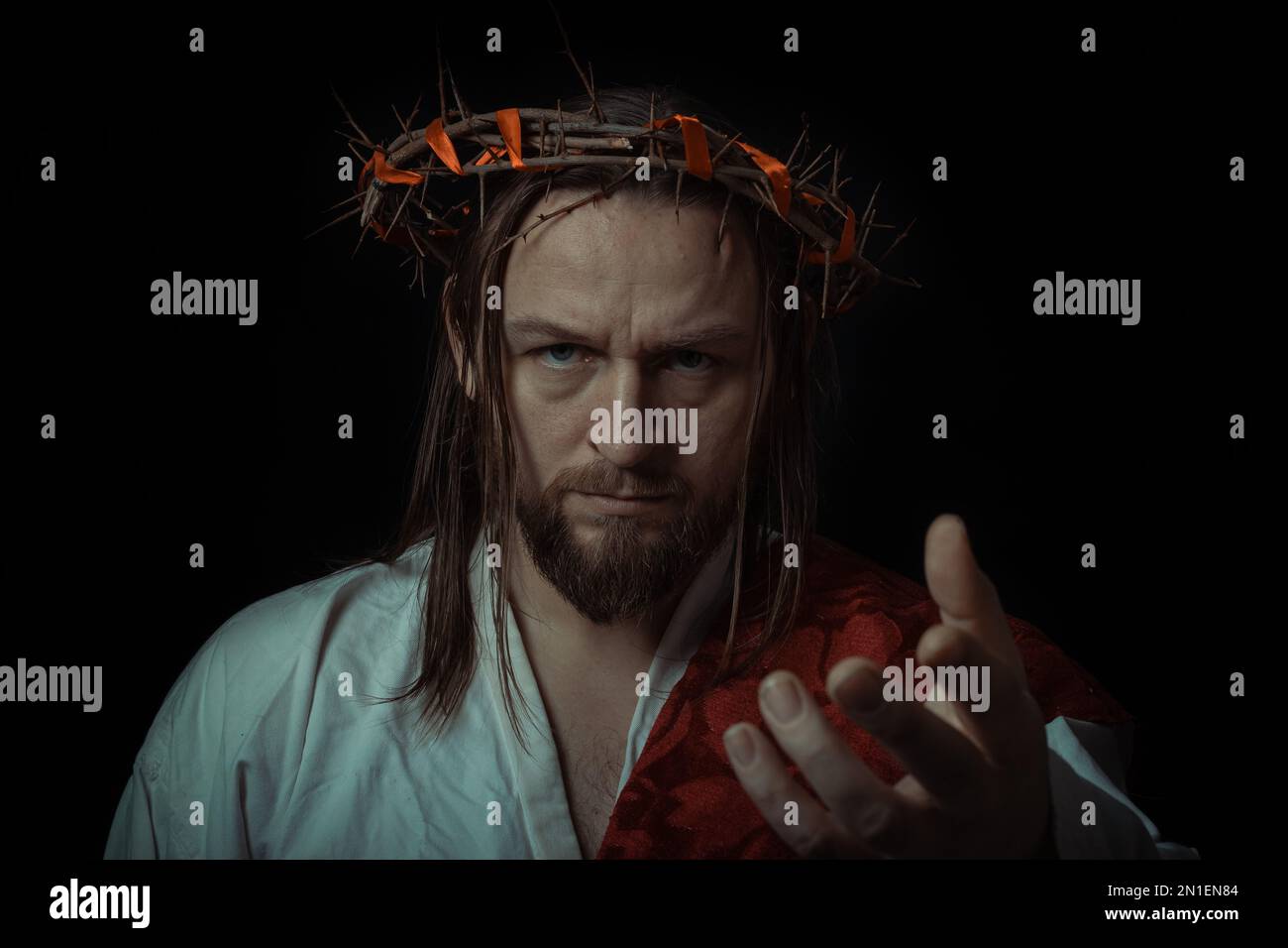 Jesus Christ wearing a crown of thorns and white chiton toga mantle