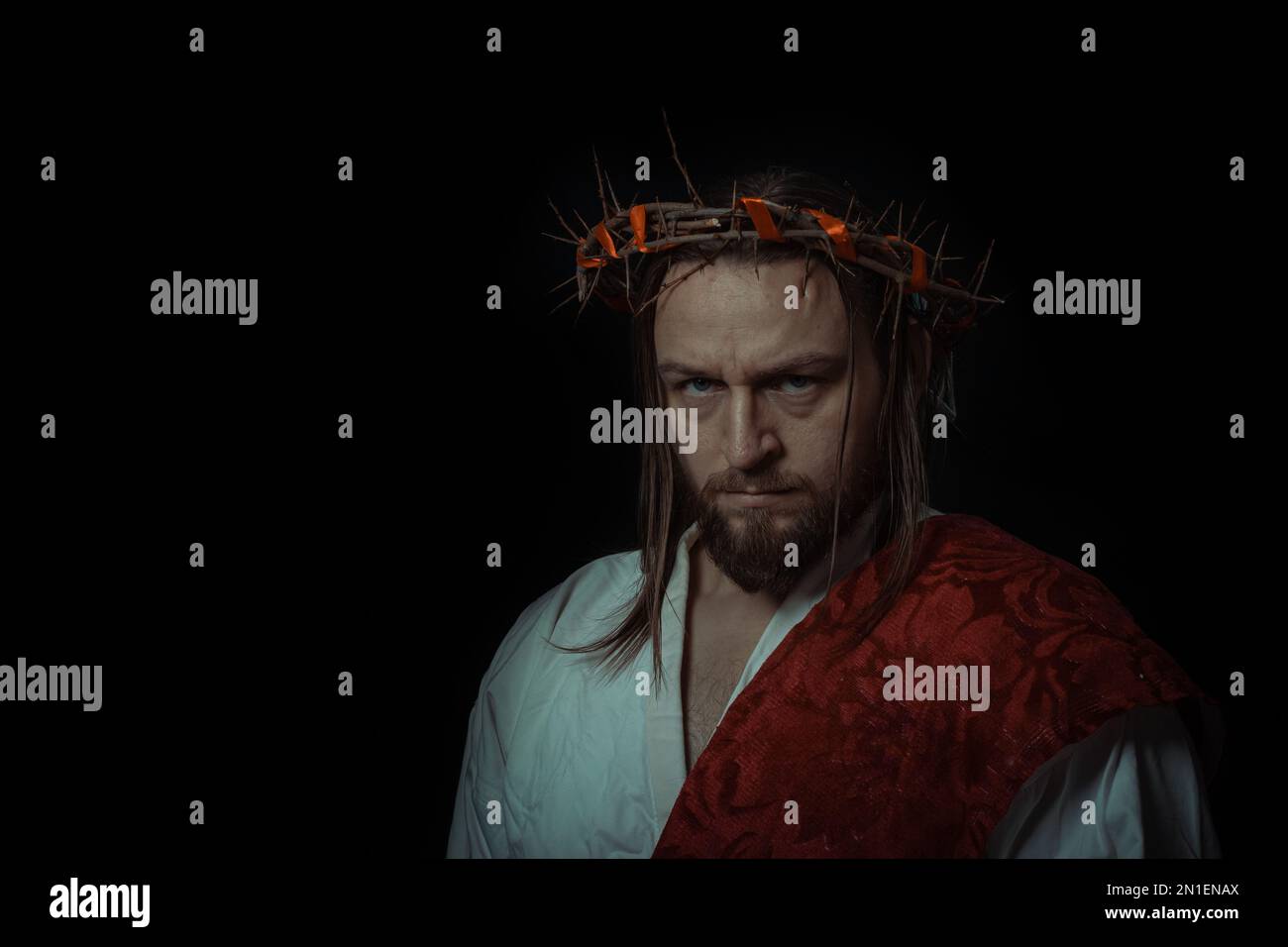 Jesus Christ wearing a crown of thorns and white chiton toga mantle ...