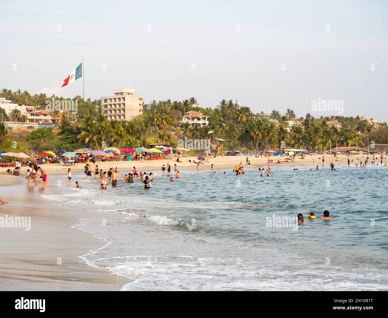 Playa Principal, the relatively calm beach at Puerto Escondido's small harbor, a favorite for swimming and eating seafood, Oaxaca, Mexico Stock Photo