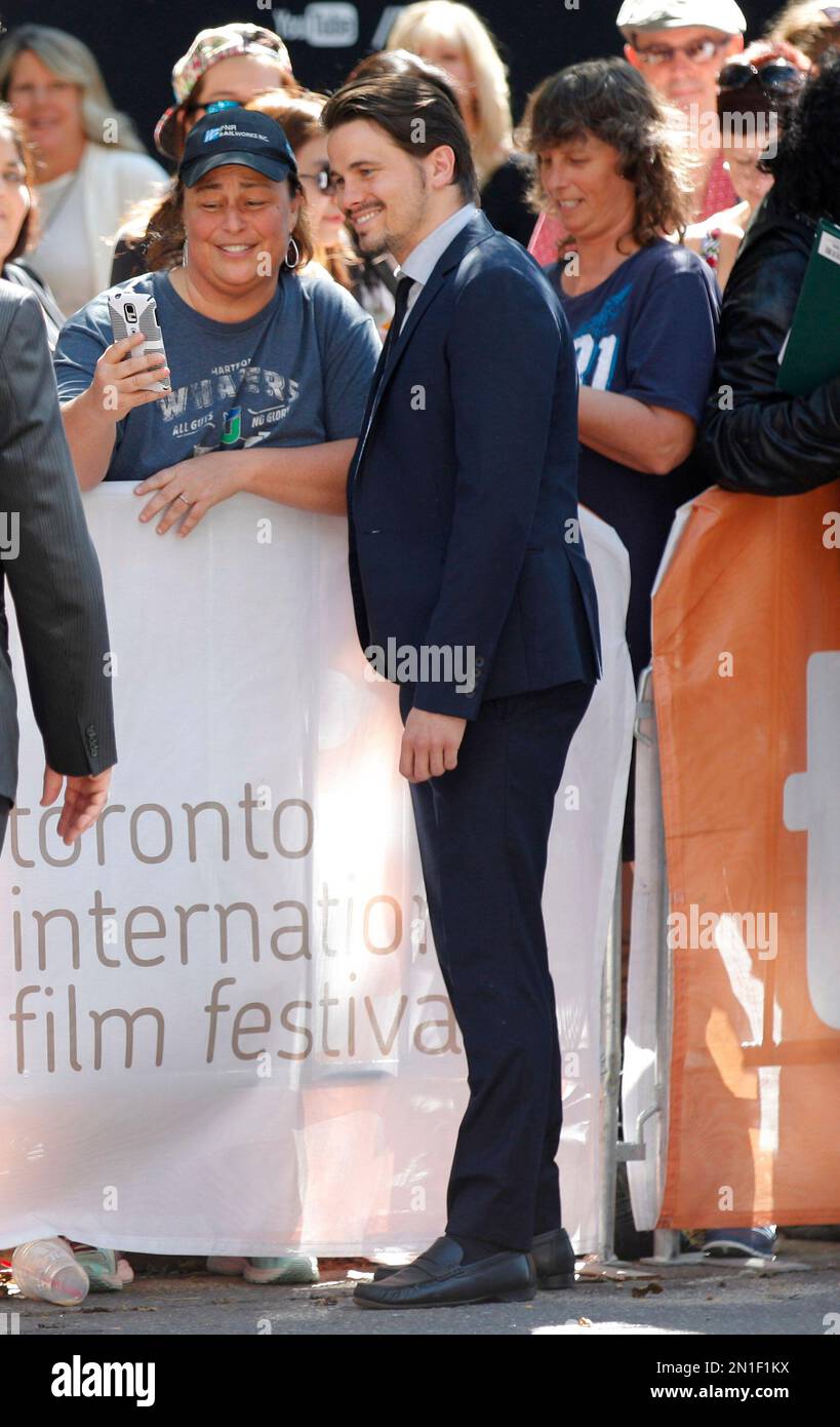 Jason Ritter signs autographs as he arrives for a premiere for &ldquo;The