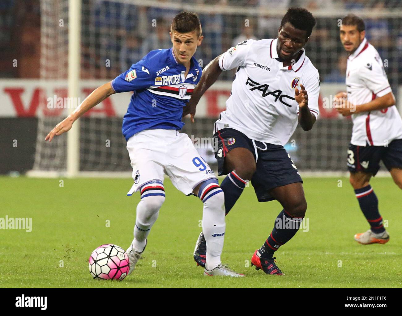 Sampdoria midfielder David Ivan, left, and Bologna midfielder Godfred
