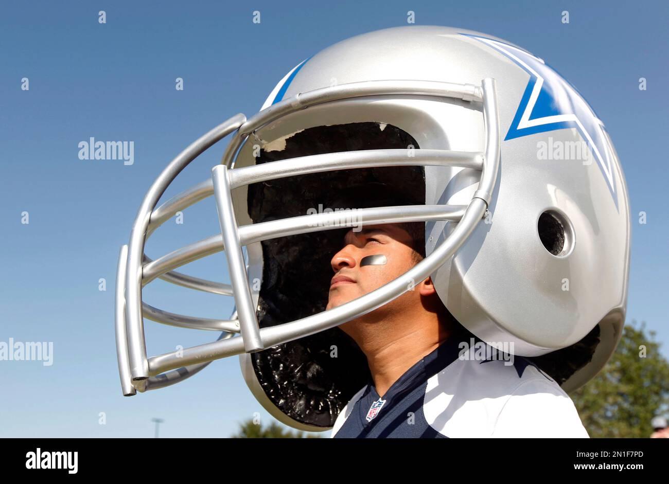 Sabino Morales from Laredo, Texas wears a large homemade Cowboys helmet