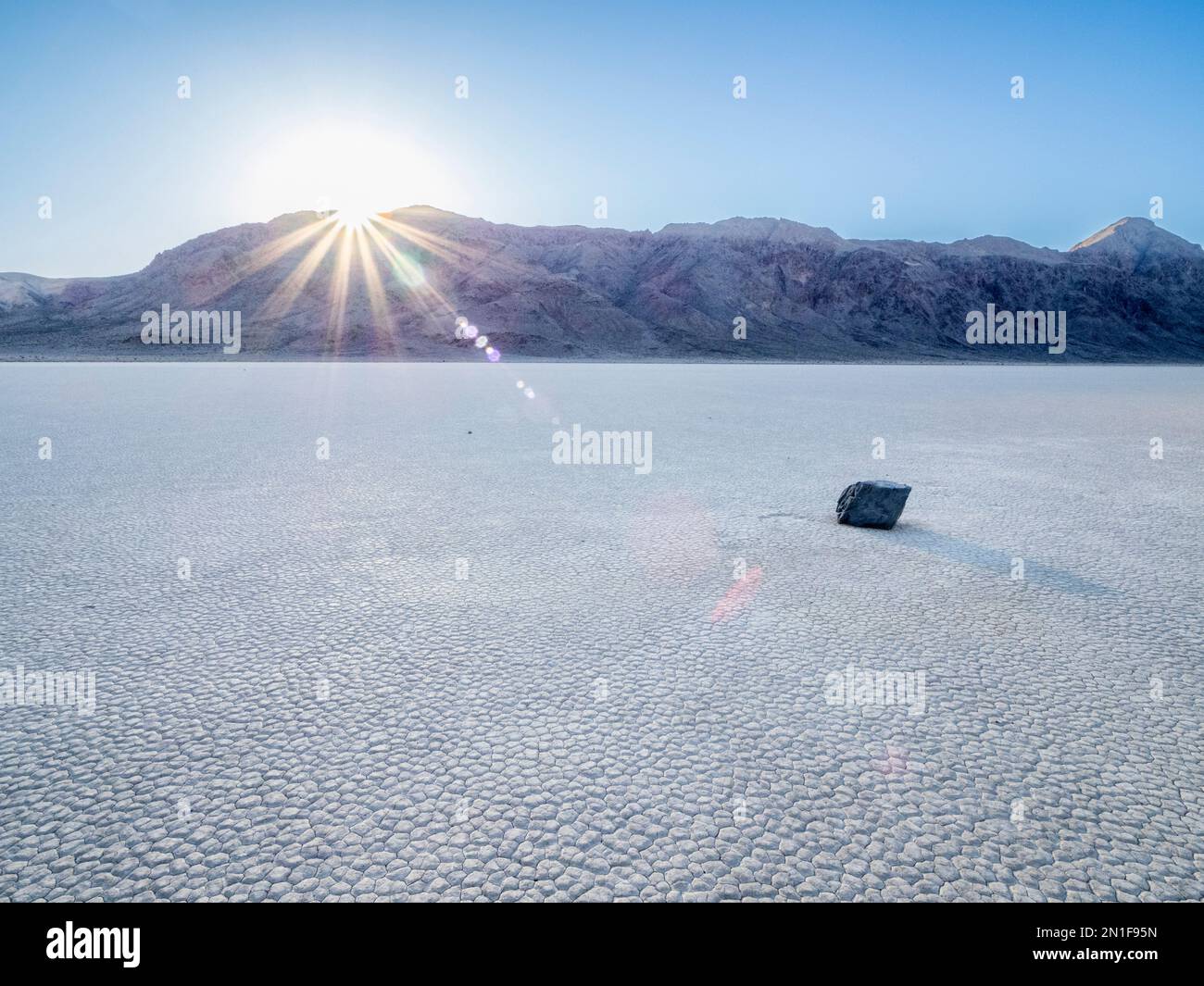 A moving rock at the Racetrack, a playa or dried up lakebed, in Death Valley National Park, California, United States of America, North America Stock Photo