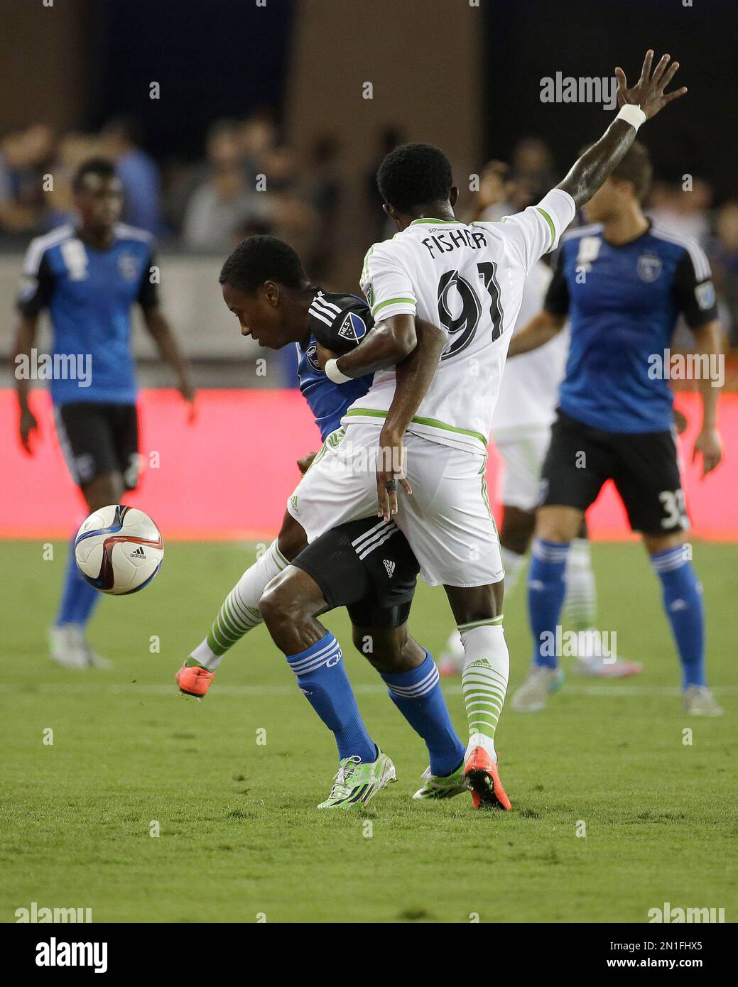 Seattle Sounders defender Oniel Fisher (91) is blocked from the ball by ...