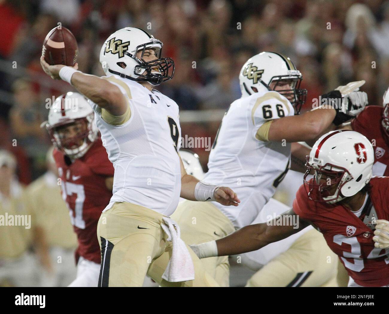Central Florida quarterback Bo Schneider throws a pass against Stanford ...