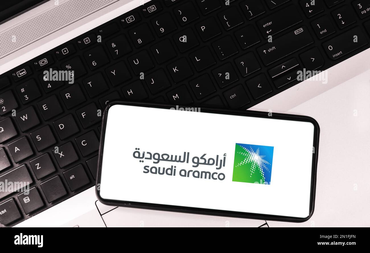 Editorial saudi oil company aramco background with mobile and laptop Stock Photo